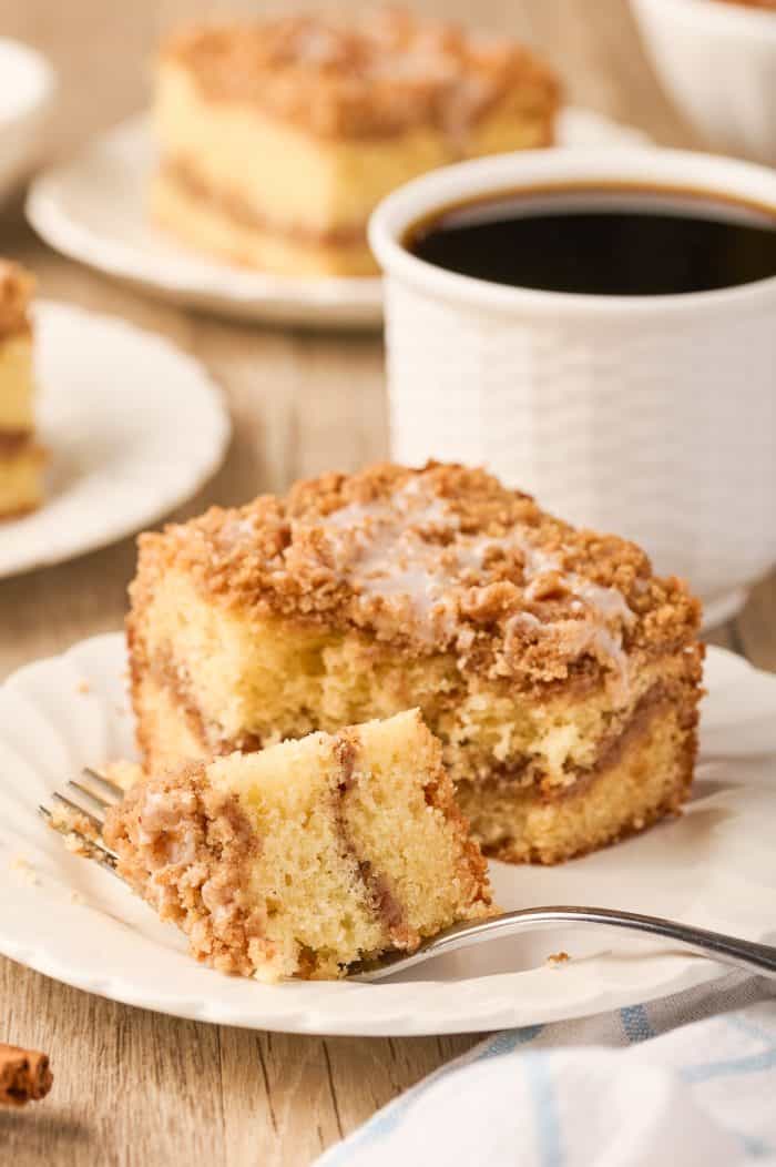 A bite of sour cream coffee cake on a fork.