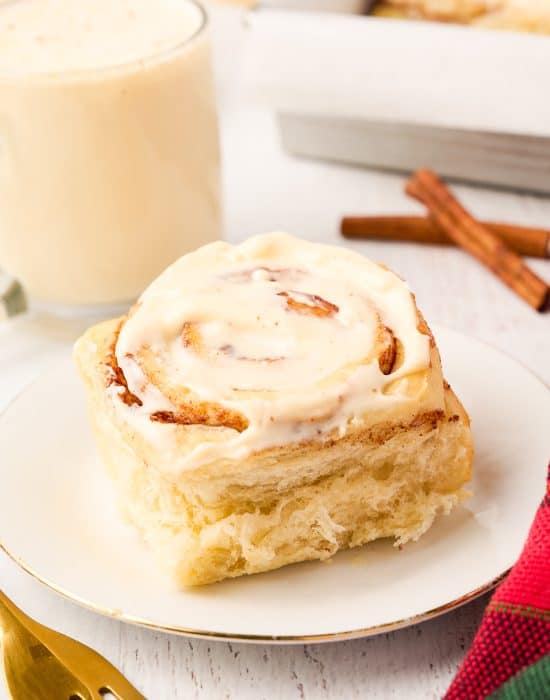 Eggnog cinnamon roll on a plate.