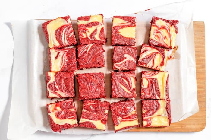 Sliced red velvet cheesecake brownies.