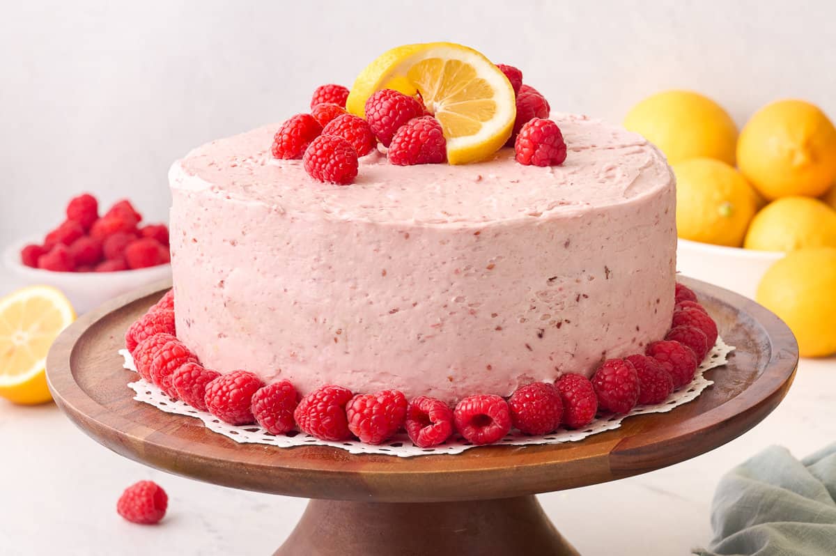 Lemon Raspberry Cake on a cake stand.