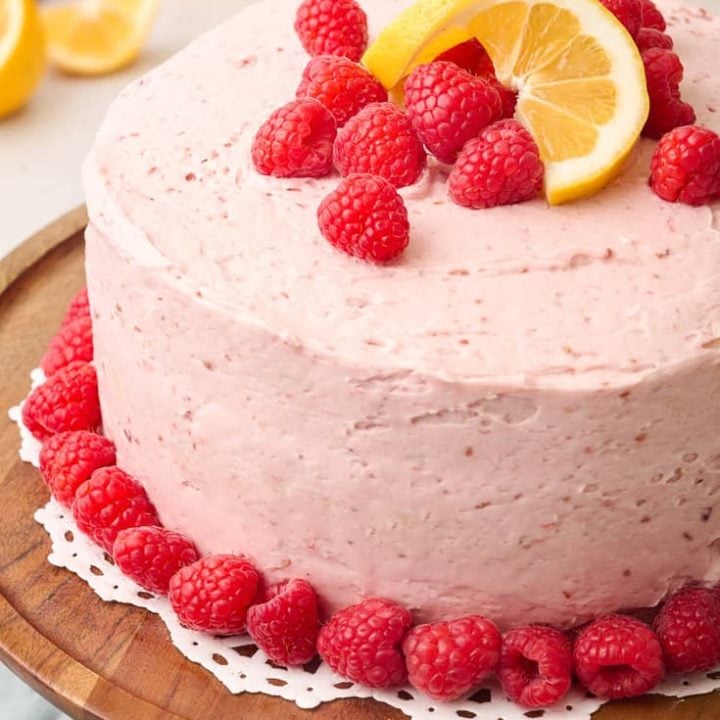 Lemon Raspberry Cake on a cake stand.