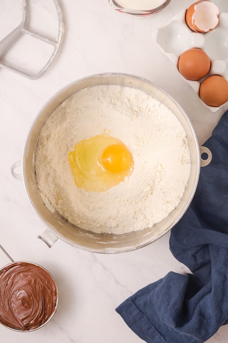 Bowl with flour and egg in it.