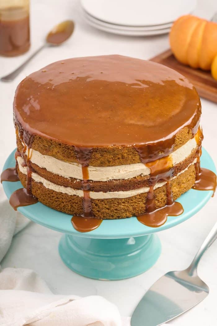 Pumpkin Layer Cake on a blue cake stand. 