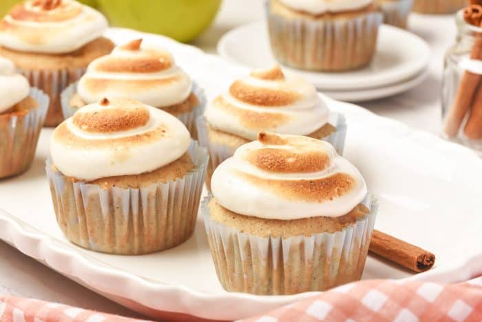 A tray of four spiced apple cupcakes.
