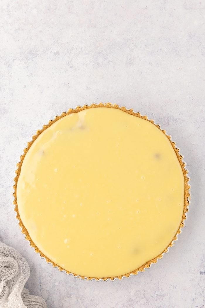 White chocolate poured over the cranberry tart.