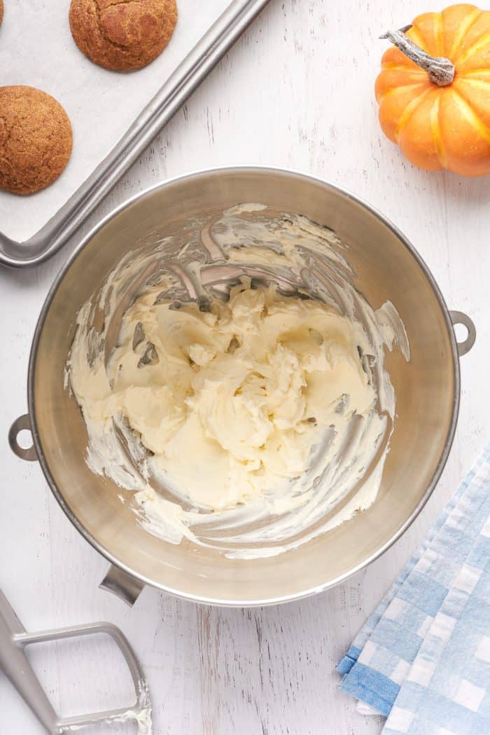 A mixing bowl with cream cheese that has been mixed.