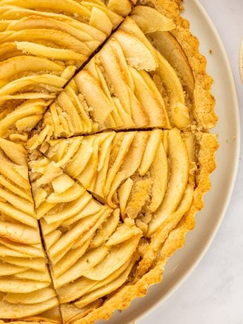 A closeup of the apple tart with three slices.