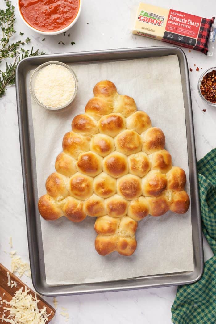 The baked pull apart Christmas tree bread on a baking sheet.