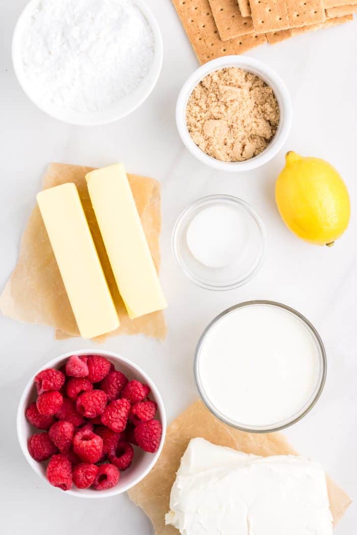 Ingredients for no bake raspberry lemon cheesecake in bowls.