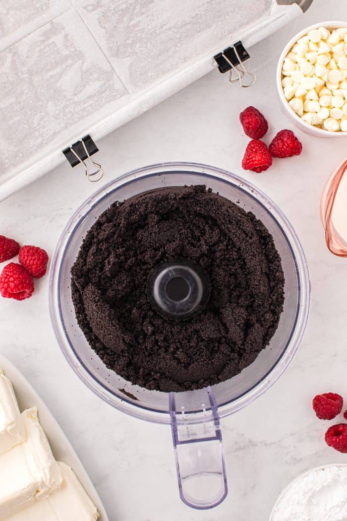 A food processor with Oreo cookie crumbs.
