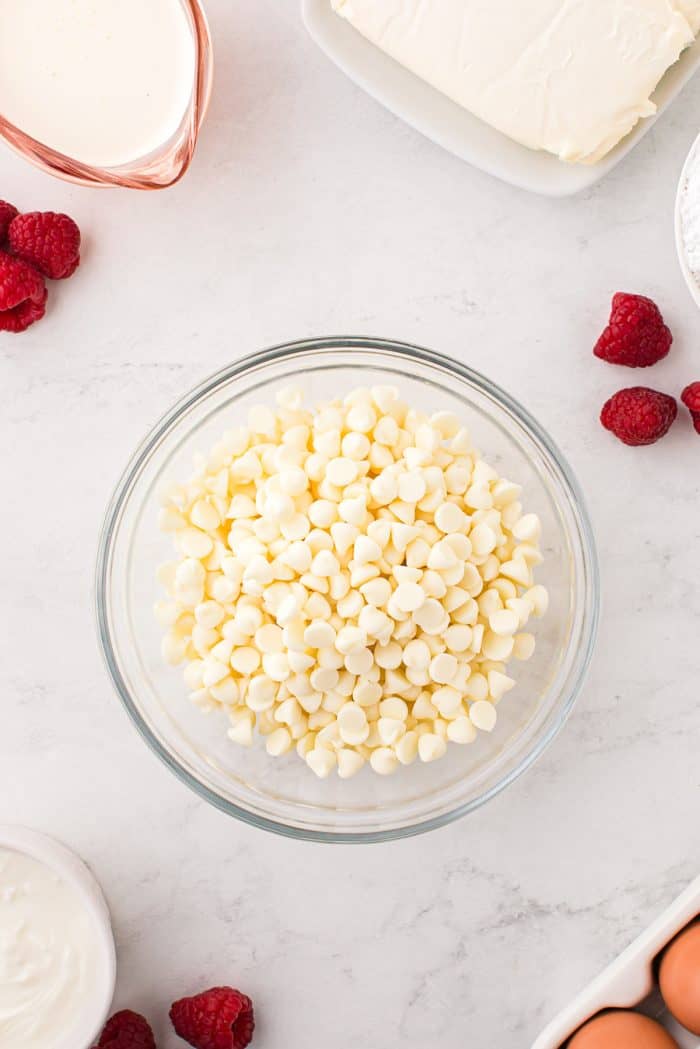 White chocolate chips in a glass bowl.