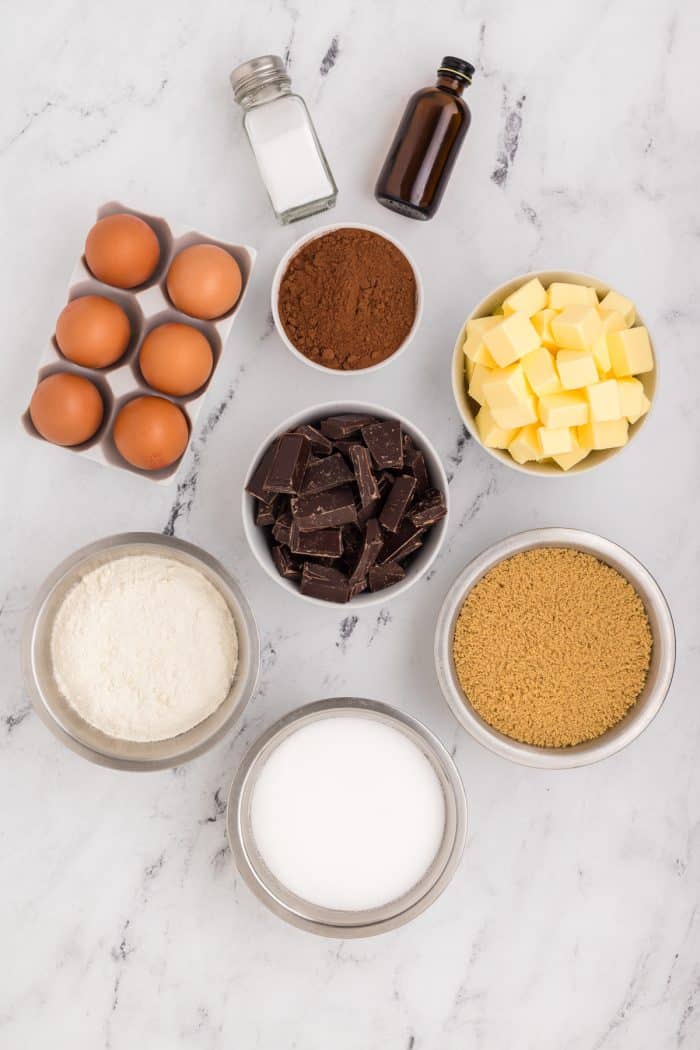 Bowls of ingredients for making chocolate brownies.