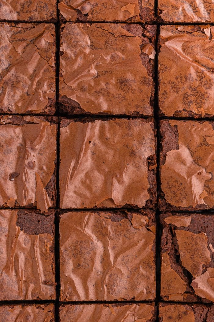 An overview of the tops of brownies showing off the crackle top.