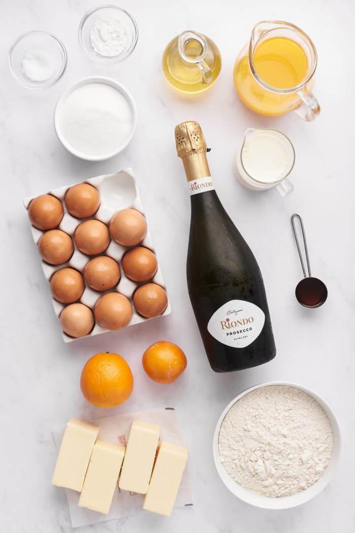 The ingredients for mimosa cupcakes in bowls.