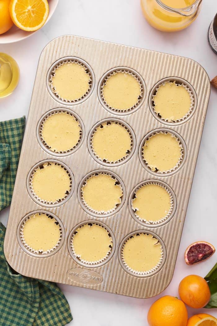 Unbaked cupcakes in a cupcake pan.
