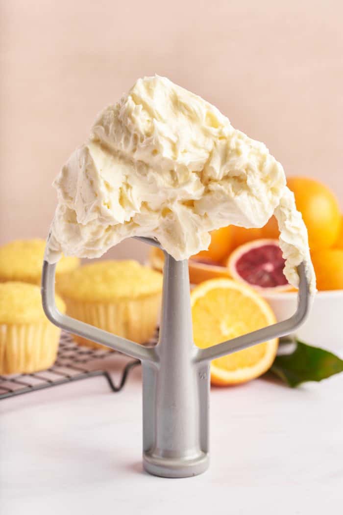Orange-infused Swiss meringue buttercream on a whisk. 