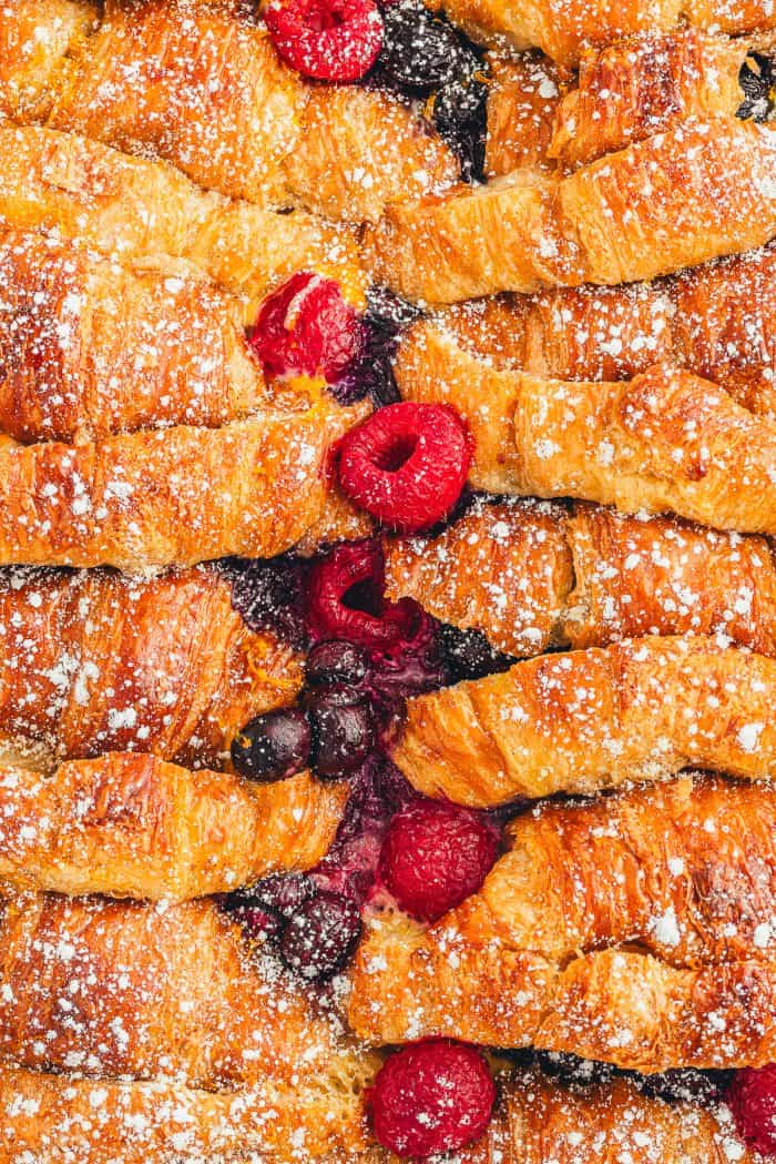 A closeup of croissant French toast bake showing the berries.