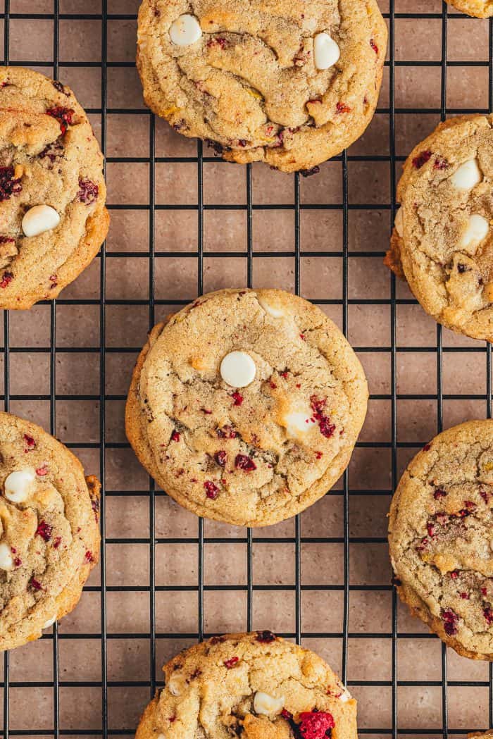 White chocolate and raspberry cookies on a cooling rack.