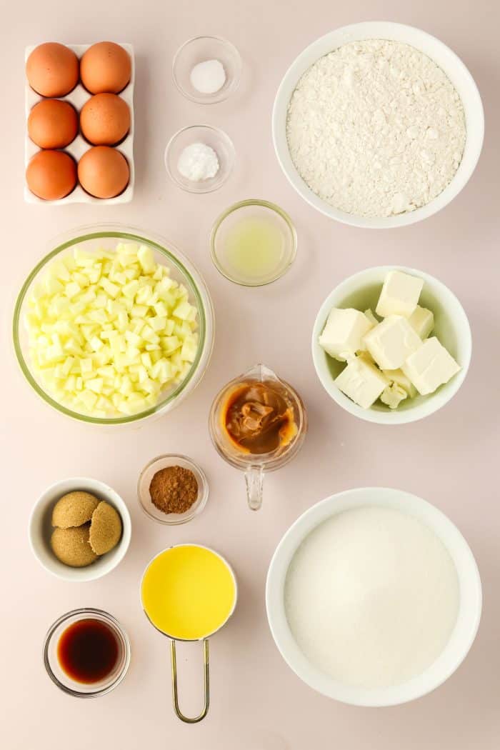 Various bowls with ingredients for caramel apple Bundt cake.