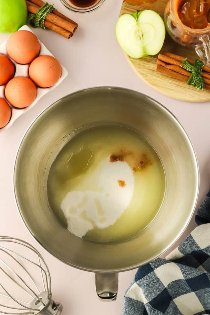 Ingredients for the cake batter in a metal mixing bowl.