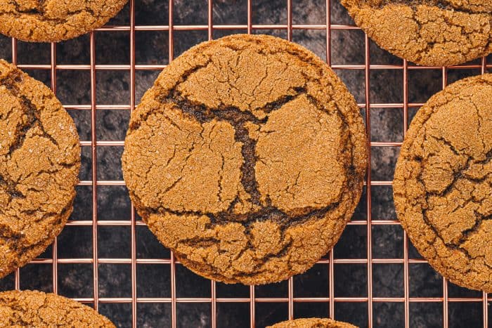 A cooling rack with soft ginger molasses cookies.