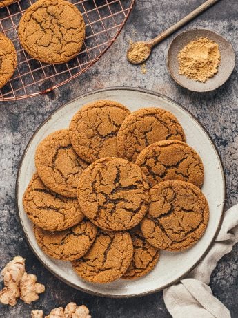 A large plate filled with ginger molasses cookies.