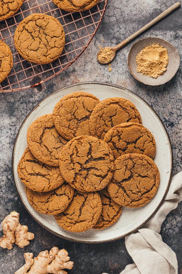 A large plate filled with ginger molasses cookies.