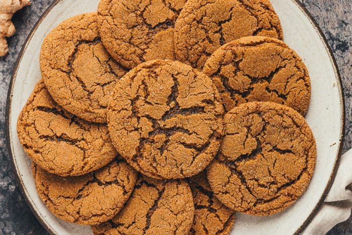 A large plate filled with ginger molasses cookies.