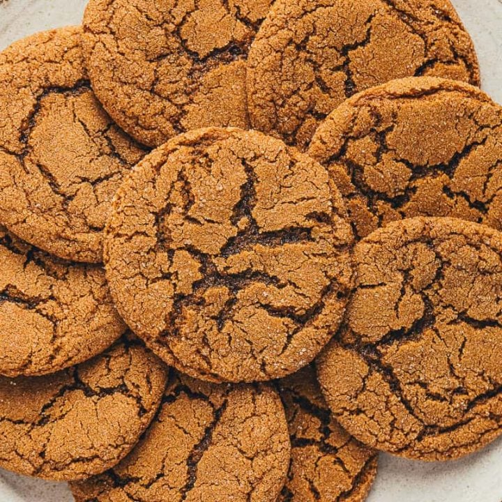 A large plate filled with ginger molasses cookies.