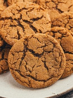 A large plate filled with ginger molasses cookies.