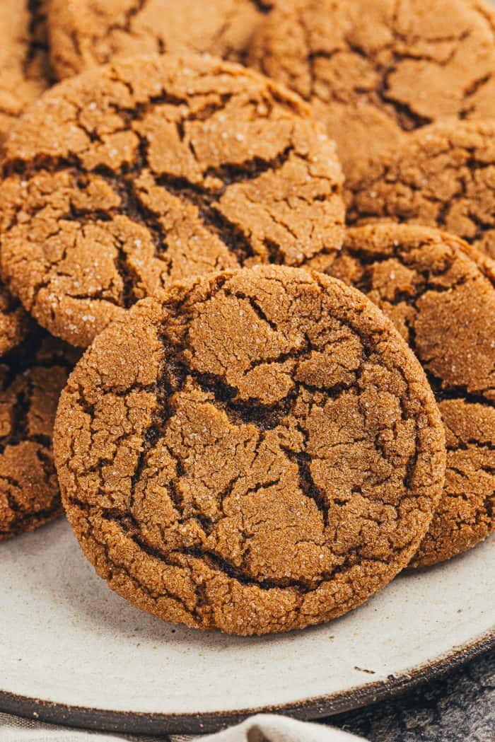 A large plate filled with ginger molasses cookies.