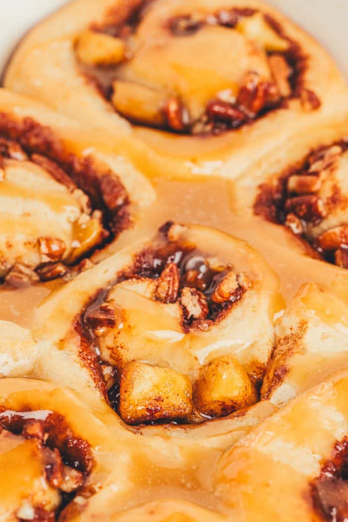 A closeup of salted caramel apple cinnamon rolls.