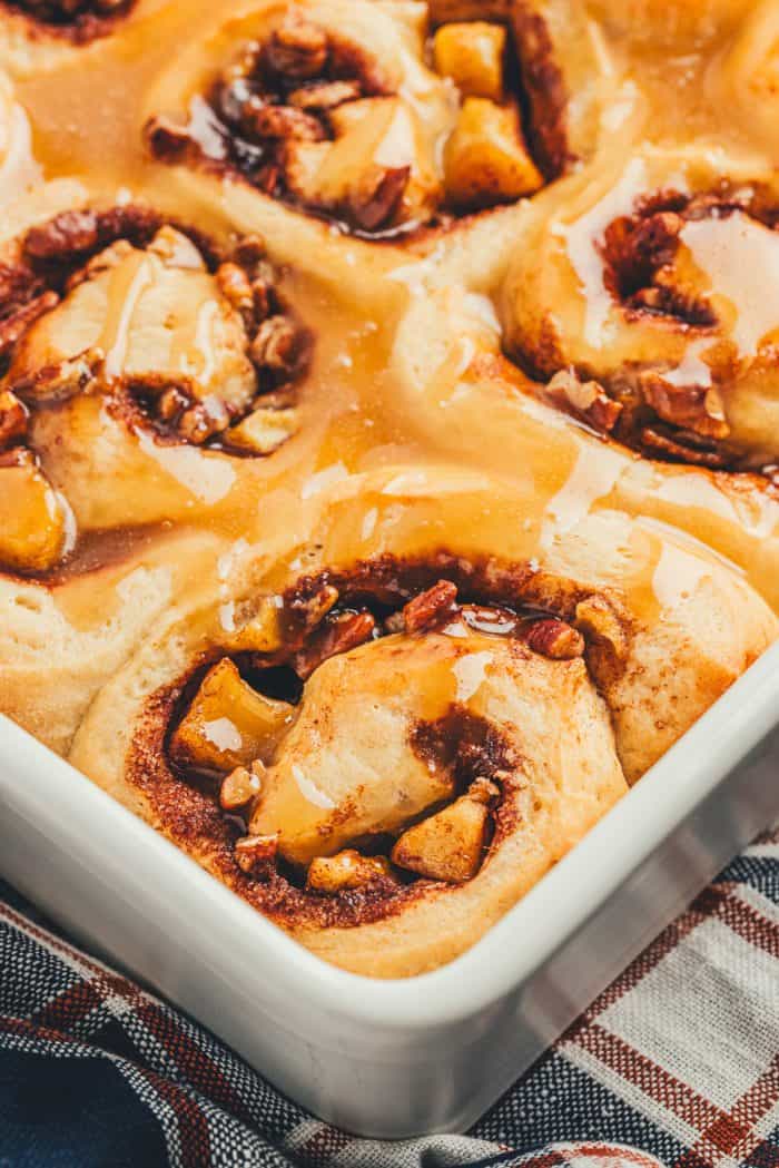 A closeup of salted caramel apple cinnamon rolls.