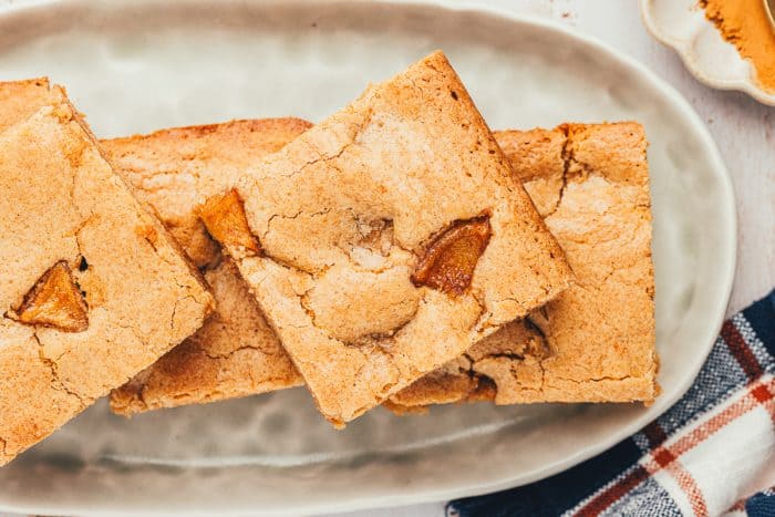 A platter with 4 Apple Blondies on it.