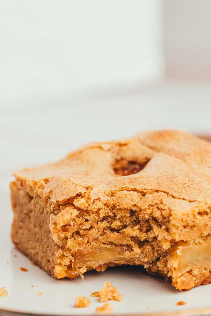 The closeup of an Apple Blondie with a bite taken out of it.