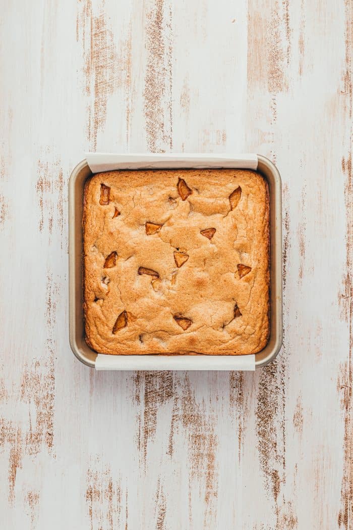 A square baking pan with baked apple pie blondies.