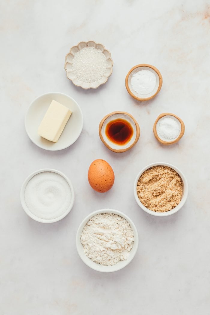 The ingredients to make brown butter sugar cookies in bowls.