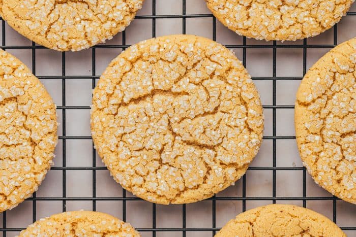 A cooling rack with various browned butter sugar cookies.