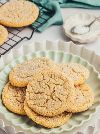 A green plate with various browned butter cookies.