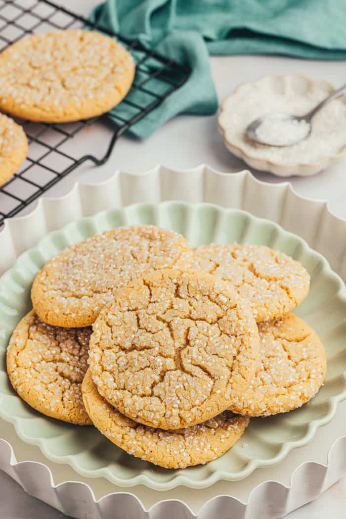 A green plate with various browned butter cookies.