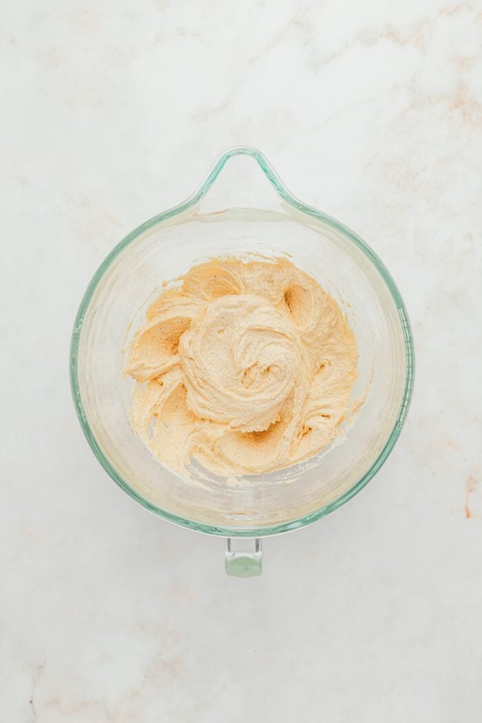 A glass bowl with creamed browned butter.