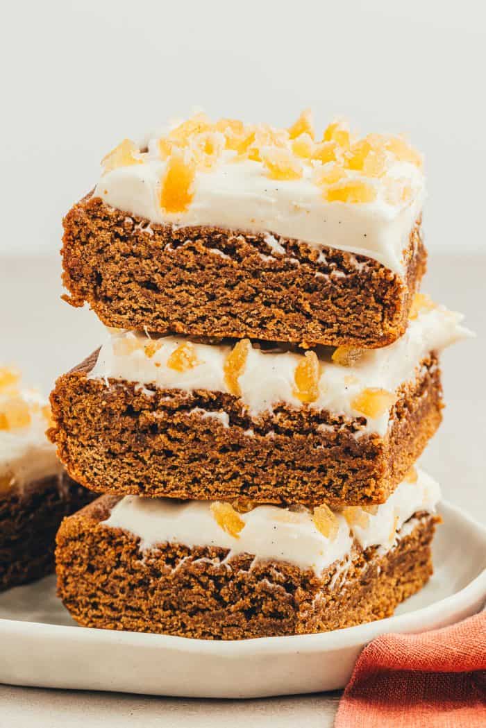 A stack of gingerbread bars on a gray plate.