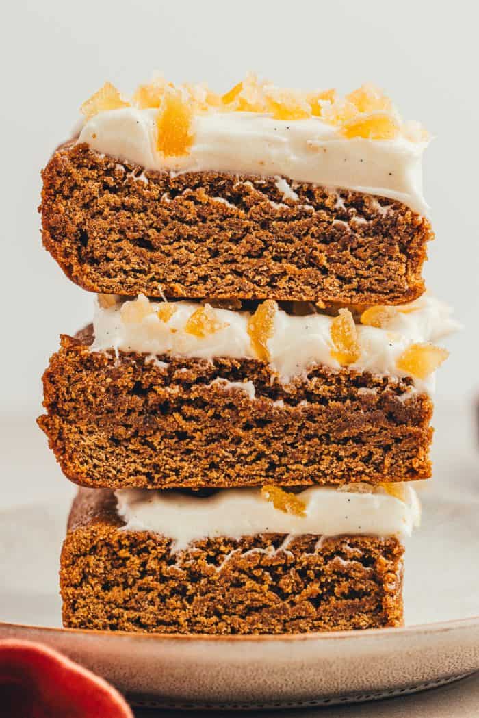 A stack of gingerbread bars on a gray plate.