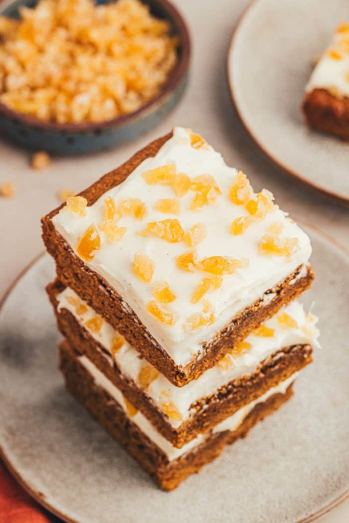 A stack of gingerbread bars on a gray plate.