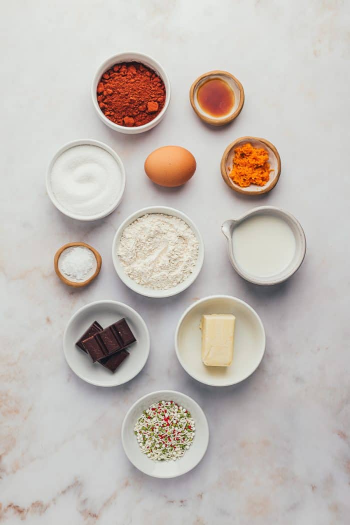 The ingredients for chocolate orange cookies in bowls.