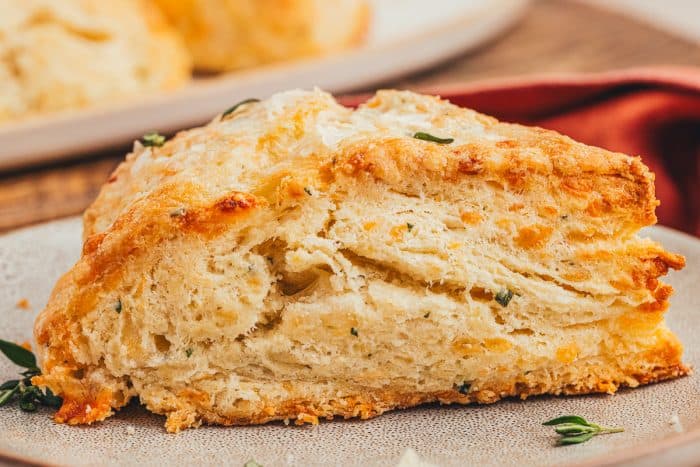 A Gruyère and Thyme Scone on a plate.