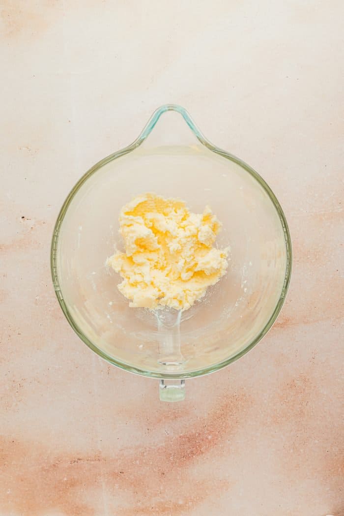 The softened butter in a glass bowl.