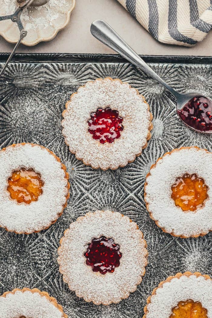 Various Linzer cookies on an antique cookie tray.