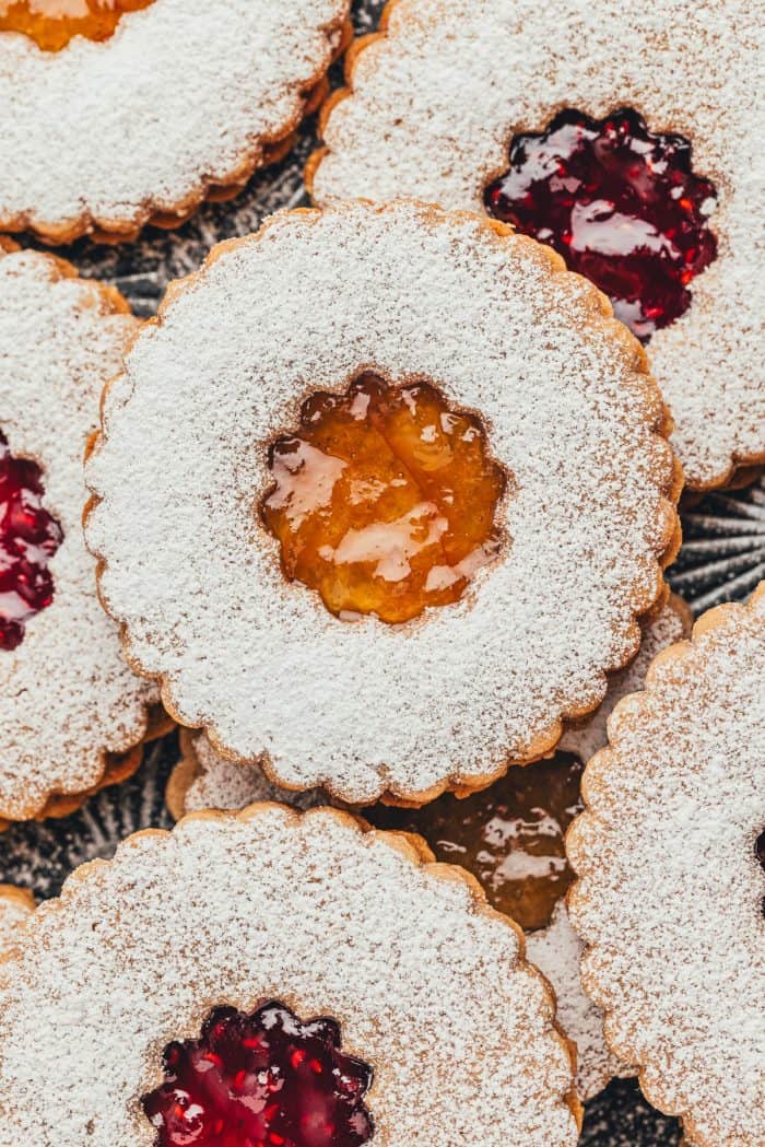 Upclose of Linzer cookies showing the jam center and powdered sugar.