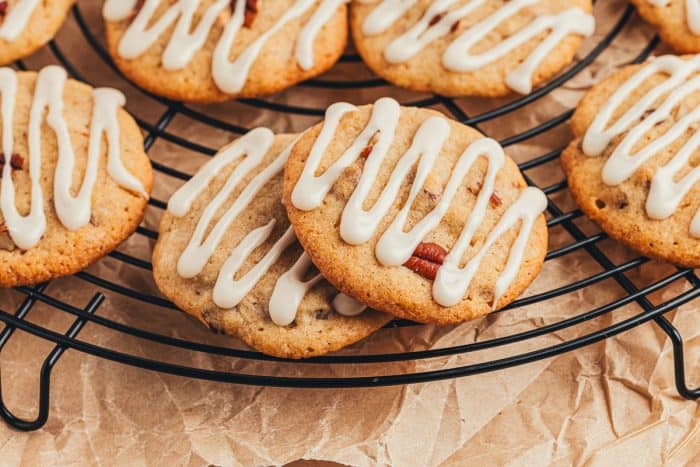 Spice drop cookies with a glaze cooling on a cooling rack.